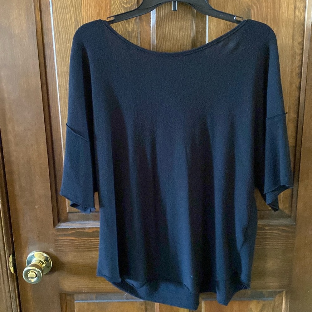 Beautiful black top from Francesca’s with back detail, size XL.